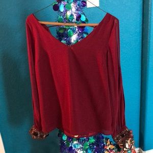 Red blouse deep v neck detailed cuffs & arm slits